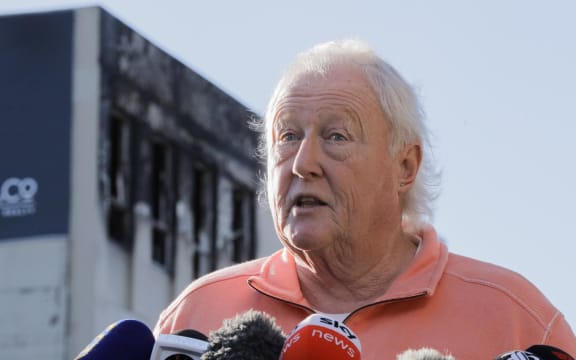 Loafers Lodge director Greg Mein speaks to media outside the partly collapsed building, in Adelaide Road, Wellington, the day after the fatal fire. 17 May 2023.