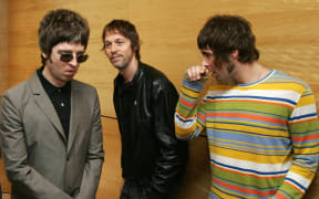 (FILES) Noel Gallagher (L) Andy Bell (C) and Liam Gallagher, members of the British rock band "Oasis" hold a photocall in Hong Kong on February 25, 2006. Fans of British rock band Oasis buzzed with anticipation on Monday, August 26, as Liam and Noel Gallagher teased that they could be returning to stage together, fifteen years after the band's last performance. (Photo by Mike CLARKE / AFP)