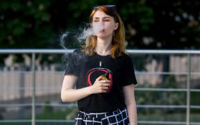 A teenager vaping.