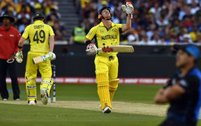 Australia's batsman David Warner (C) looks towards the sky after New Zealand's fielder Ross Taylor (R) dropped his potential catch.