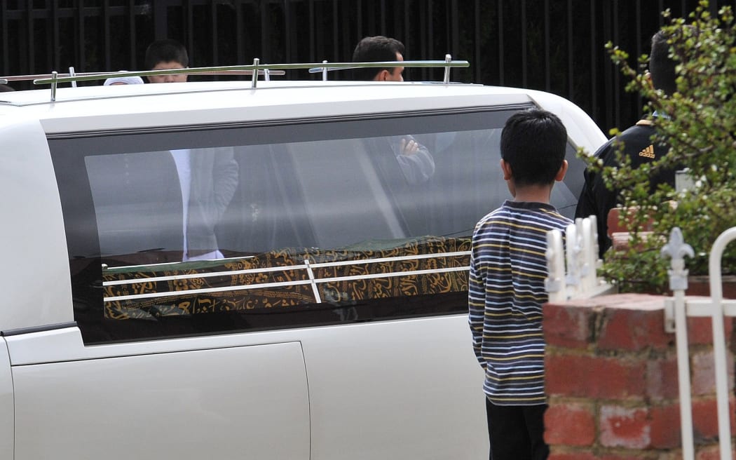 The video mentions Numan Haider who was shot dead last September, the picture shows his body leaving the Afghan Mosque of Victoria.