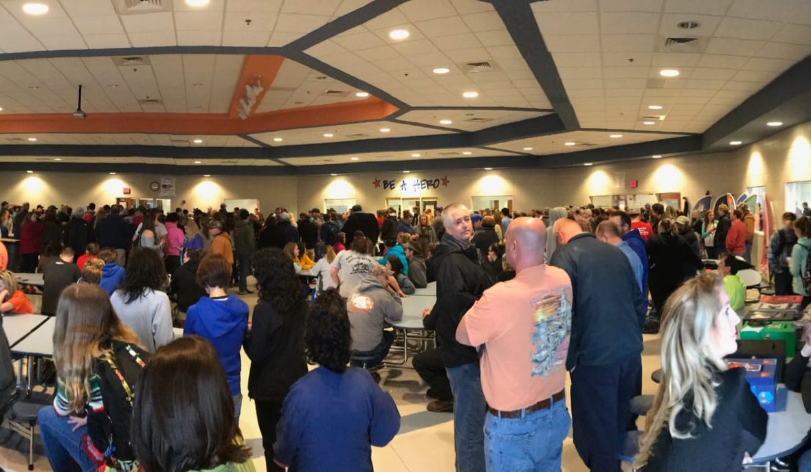 Parents wait at North Marshall Middle School to be reunited with children caught up in the Marshall County High School shooting