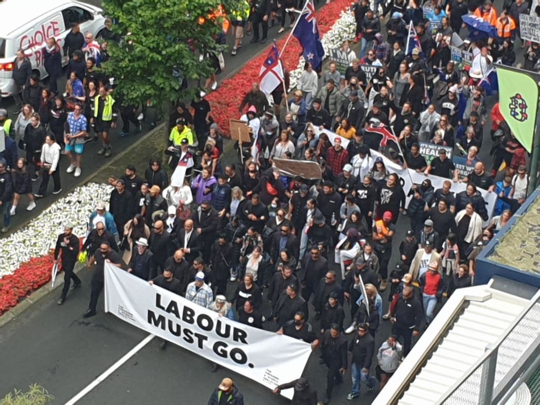 Protesters take to the streets in a march against Covid-19 restrictions in downtown Wellington on 16 December.