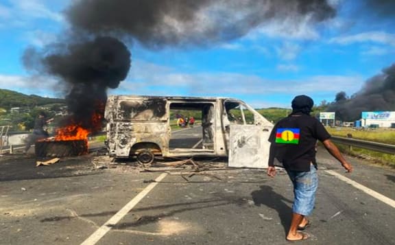 Burnt van and tyres at one roadblock near Nouméa’ Magenta industrial zone