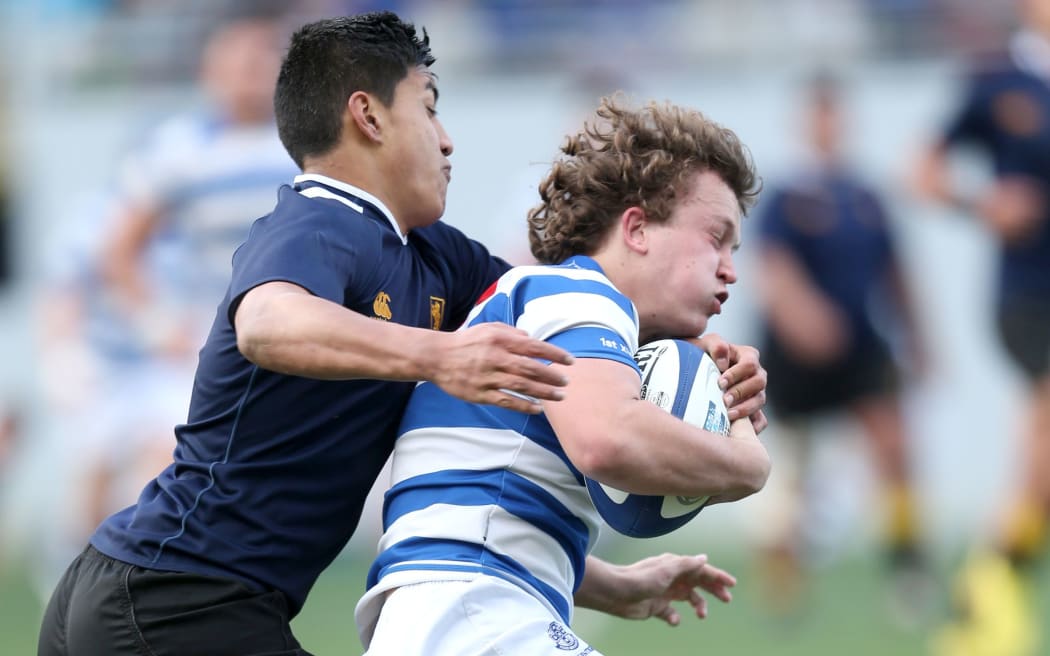 Rieko Ioane makes a tackle for Auckland Grammar during the 2013 Auckland secondary schools final against St Kentigern.