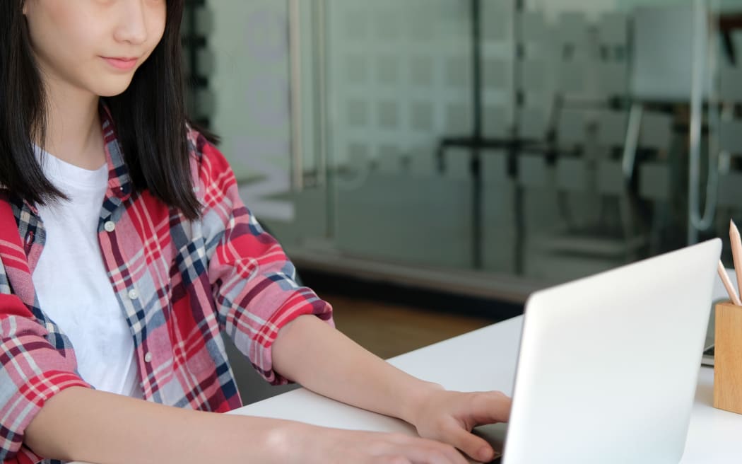 girl teenager college high school student studying with computer laptop