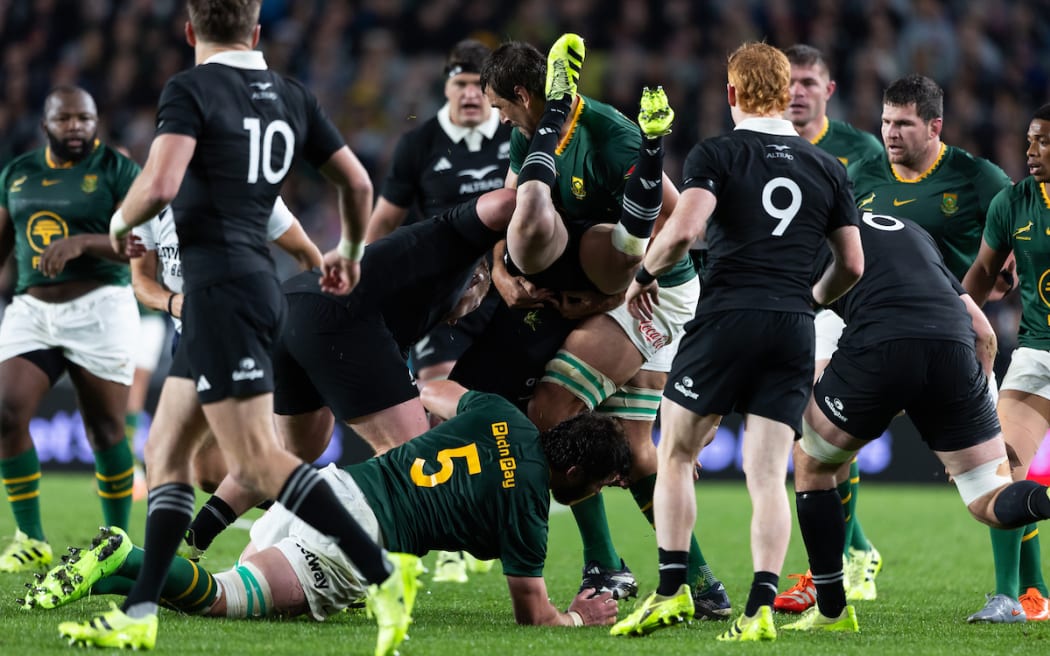Damian McKenzie is upended by Springbok Eben Etzebeth.