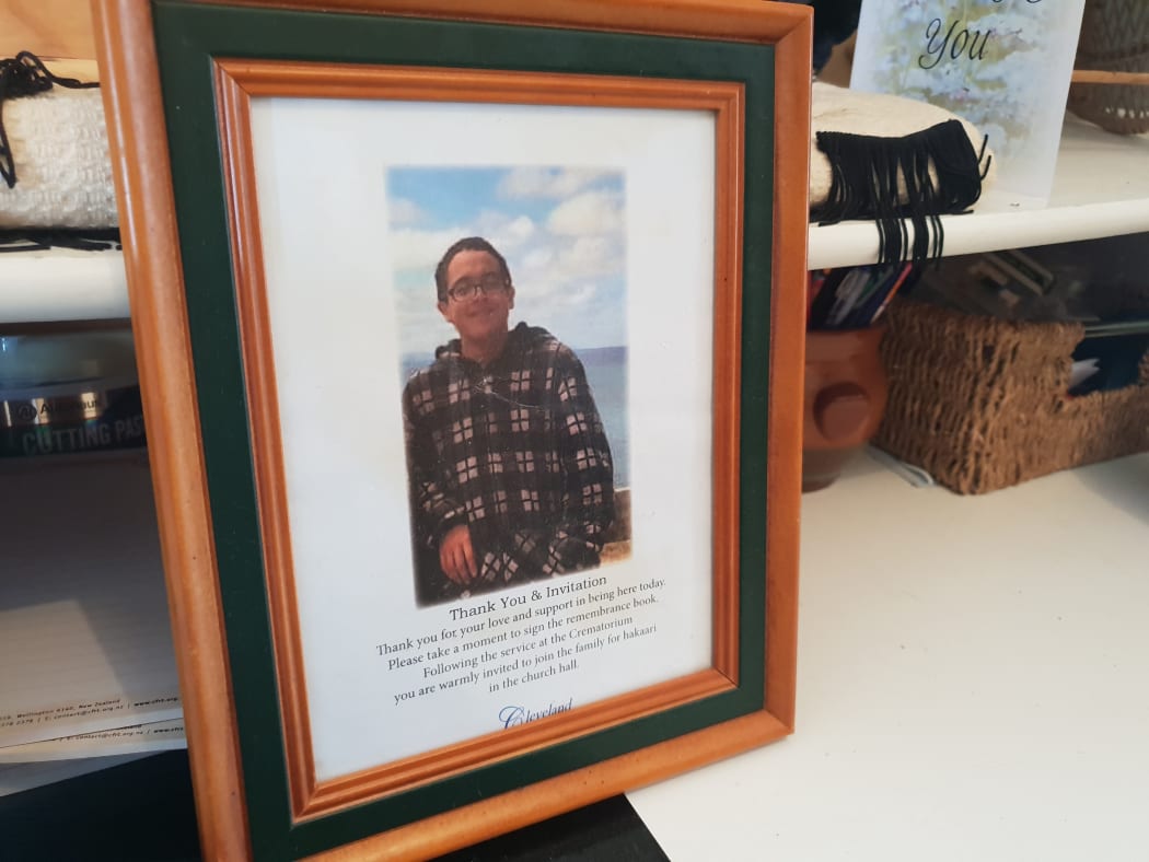 A framed photo of Sonny Marks sits next to his ashes at Ana Ransfield's home