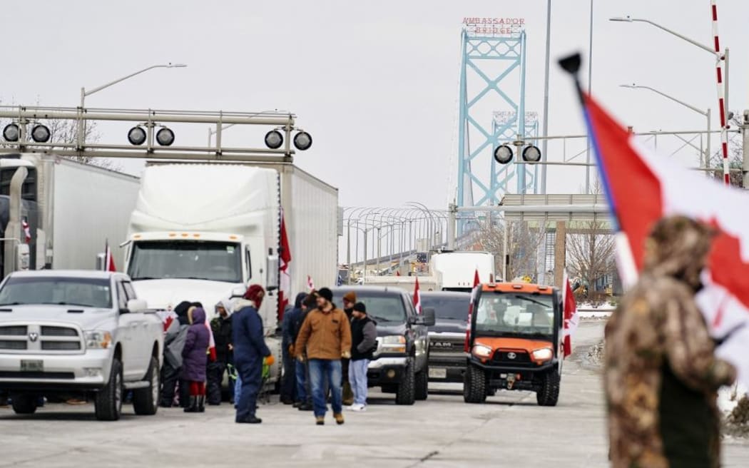 Supporters of the Truckers Convoy against the Covid-19 vaccine mandate block traffic in the Canada bound lanes of the Ambassador Bridge border crossing, in Windsor, Ontario, on February 8, 2022.
