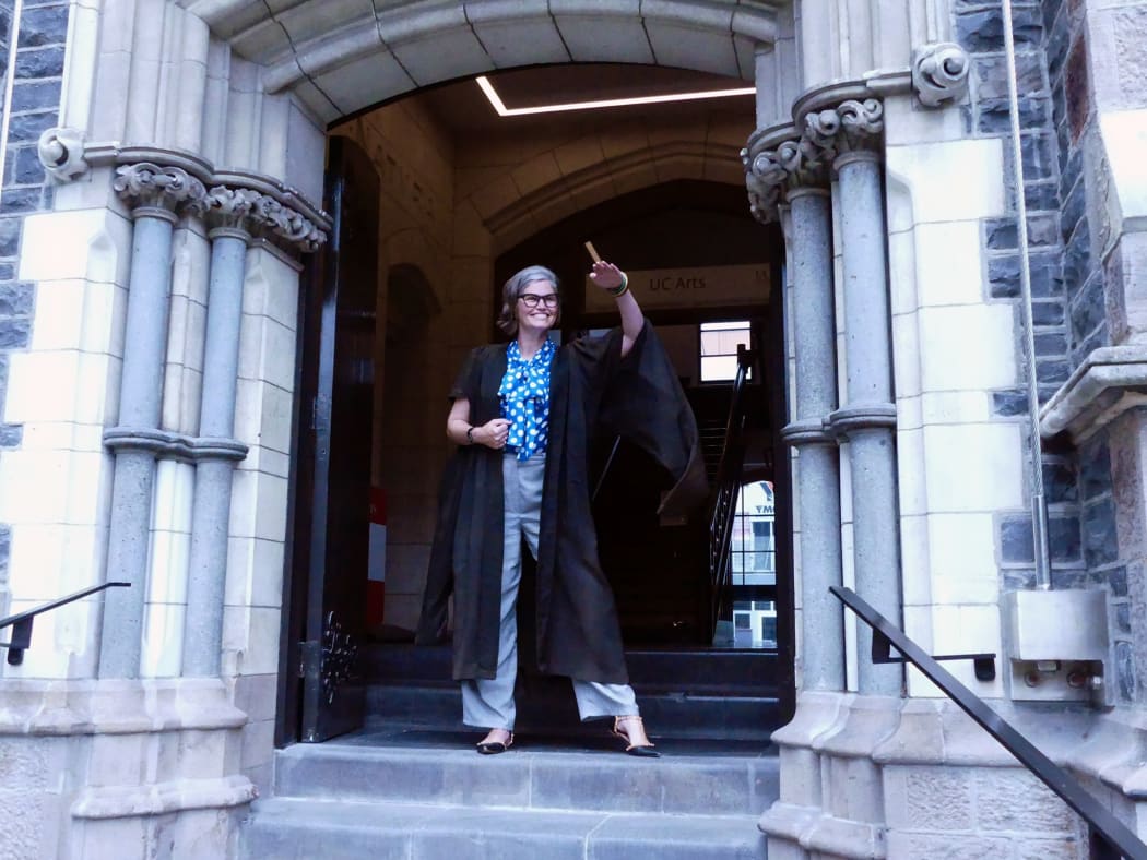 UC Arts City Location Manager Naomi van den Broek models a gown once worn on a daily basis by academic staff.