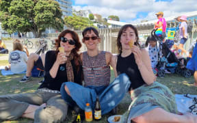 Friends Amy Hartwell, Iris Garstang and Olivia Ferguson cool off with a gelato and some shade at Freyberg Beach.
