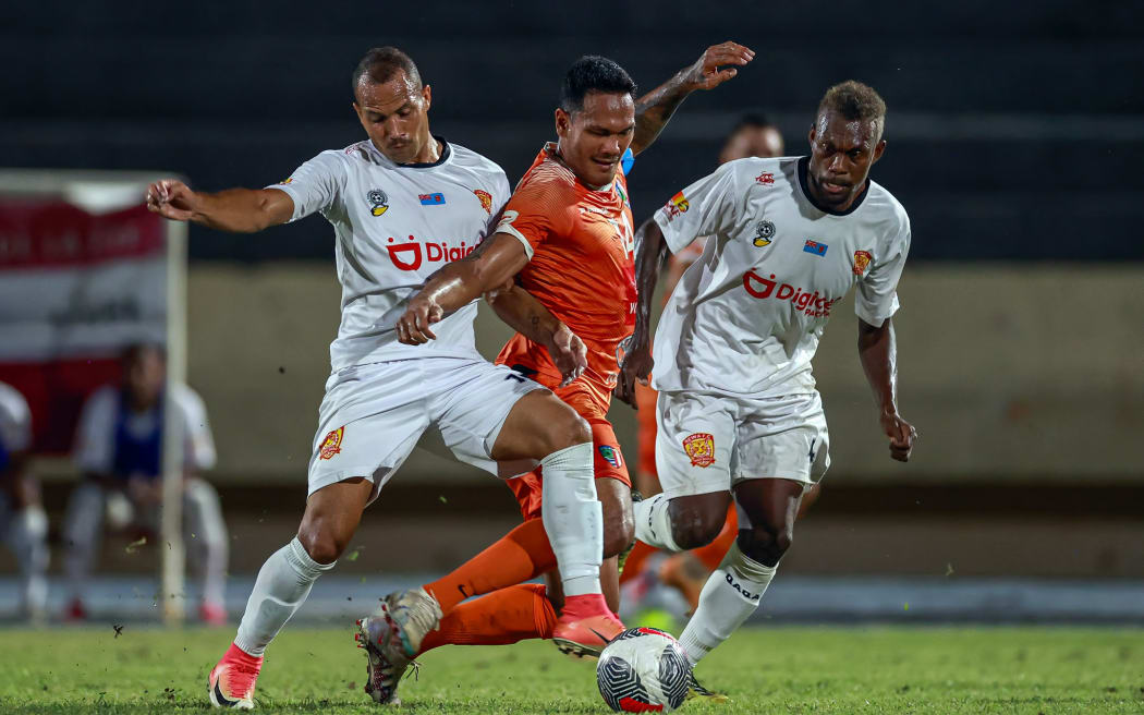 AS Pirae's Alvin Tehau Rewa FC's Tevita Waranaivalu Rewa FC's Leon Kofana. OFC Men's Champions League 2024, Semi Final 2, AS Pirae v Rewa FC, Stade Pater, Tahiti, Wednesday 22 May 2024. Photo: Shane Wenzlick / www.phototek.nz