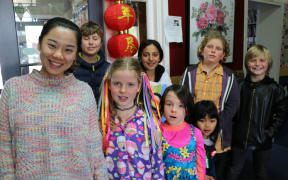 Te Aro Primary students with MLA Chinese teacher Jingwen Zhang.