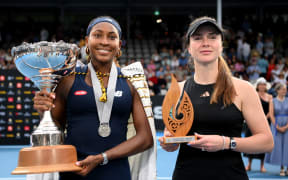 Coco Gauff of USA and Elina Svitolina of Ukraine pose with their trophies after playing in the Women's singles final match during the 2024 Women's ASB Classic at ASB Tennis Centre.