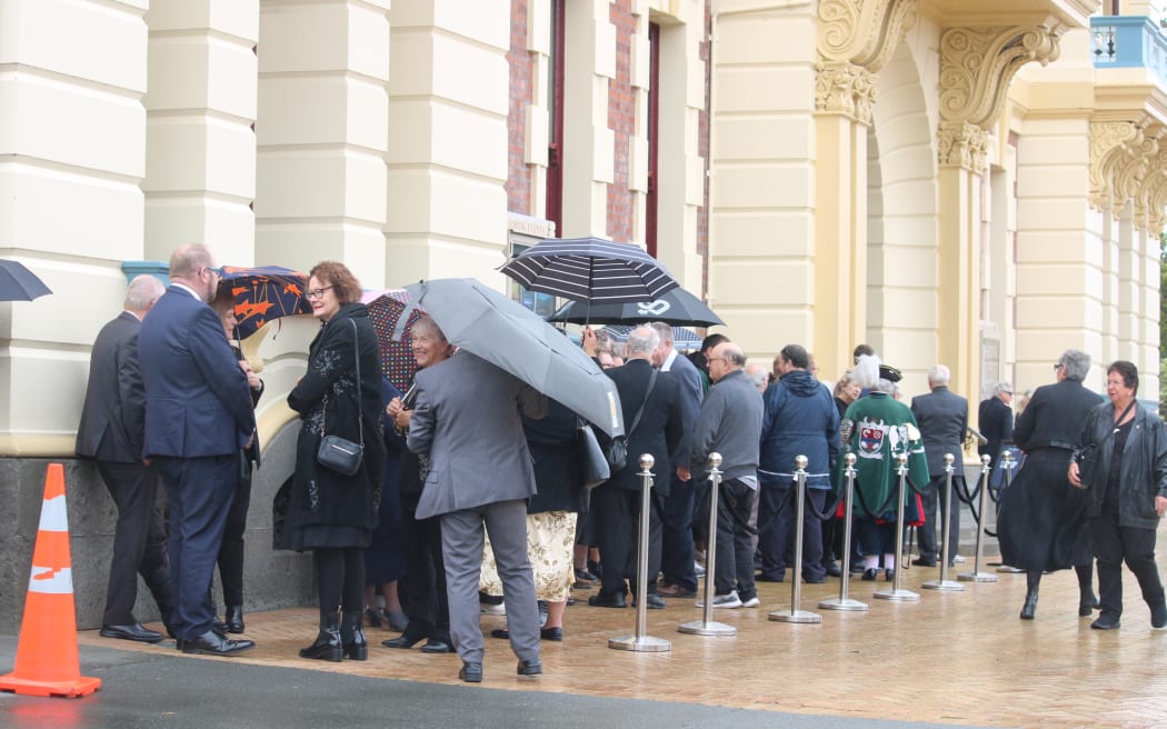 Mourners queued under umbrellas to pay their respects to Sir Tim Shadbolt, whose funeral is getting underway in Invercargill.