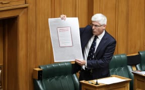 National MP Tim McIndoe has brought visual aids. This one is a full page advert by doctors opposed to the End of Life Choice Bill.