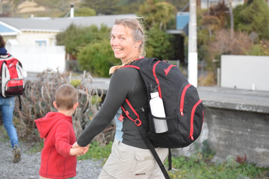 A photo of the event organiser, Jenny Cunningham, walking alongside the seashore in Moncks Bay