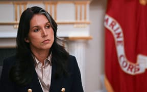 US Director of National Intelligence Tulsi Gabbard listens as President Donald Trump speaks during a Cabinet Meeting in the Cabinet Room of the White House in Washington, DC on December 2, 2025. (Photo by ANDREW CABALLERO-REYNOLDS / AFP)