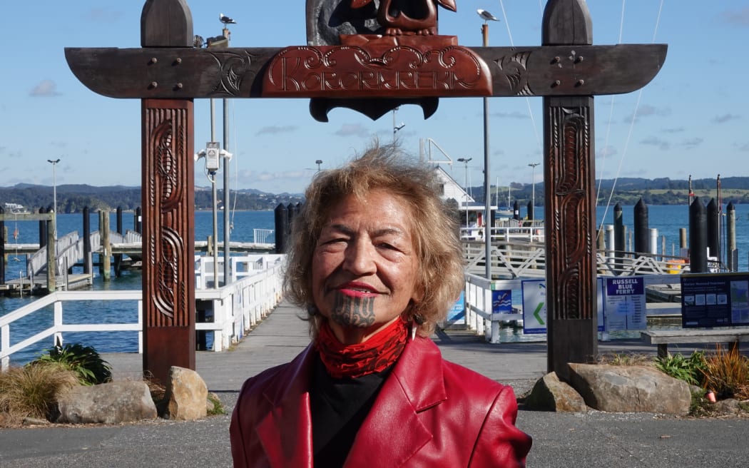 Kororāreka Marae chairwoman Deb Rewiri by the waharoa (gateway) welcoming visitors to the Bay of Islands town.