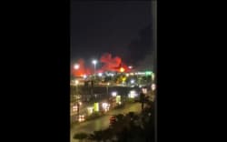 This frame grab made from a UGC video footage of an unknown source posted on social media on July 8 show explosions going off in Iran’s major port city of Bandar Abbas. The United States launched extensive strikes on Iran over attacks on ships in the vital Strait of Hormuz, triggering a wave of reprisals on July 8 that Iran’s Guards said targeted US bases in the Gulf. Both sides reported hitting dozens of targets in renewed hostilities, which have placed fresh strain on an interim deal to end the Middle East war and pushed oil prices to their highest level in two weeks. (Photo by various sources / AFP) /