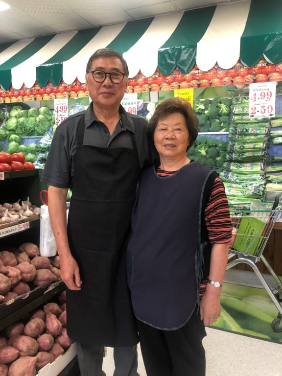 Jack and Carrie Lum in their fruit and vege shop after 50 years in business, Remuera, Auckland, January 2020