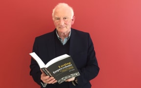 Ian F Grant with his new book covering 80 years of new Zealand newspaper history.