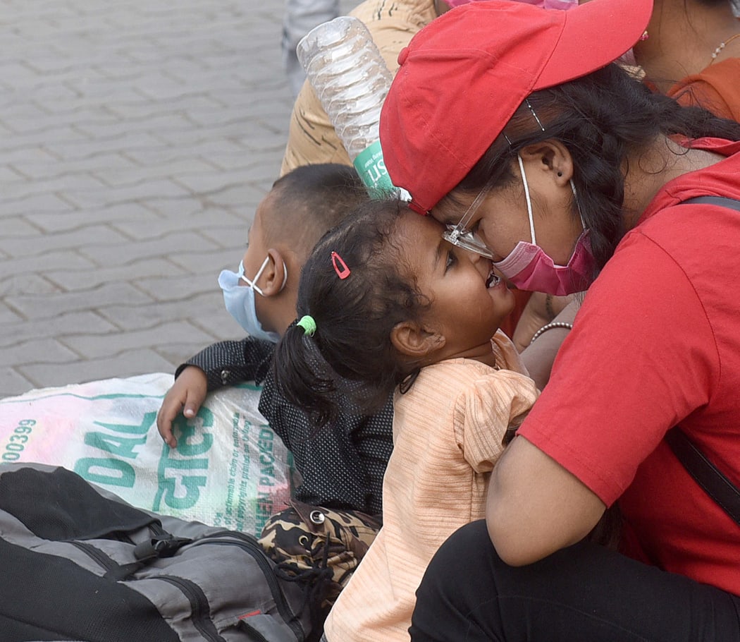 A family travelling within Delhi - many in India faced difficult situations after being separated from home and loved ones by lockdowns, disruptions, and the danger of catching Covid-19 in public spaces.