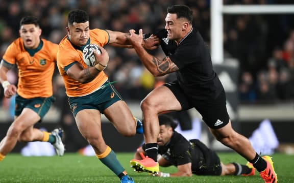 Hunter Paisami (L) gets past Codie Taylor.
New Zealand All Blacks v Australia Wallabies. Bledisloe Cup rugby union test match. Eden Park, Auckand, New Zealand. Saturday 7 August 2021.