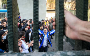 People gather to protest over high cost of living in Tehran, Iran on December 30, 2017.