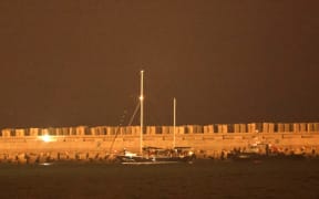 A picture shows the aid sailboat Madleen at the southern port of Ashdod after being intercepted by Israeli forces on June 9, 2025. Israeli forces intercepted the Gaza-bound aid boat Madleen, operated by the Freedom Flotilla Coalition activist group, on June 9, preventing the activists on board from reaching the blockaded Palestinian territory. (Photo by Jack GUEZ / AFP)