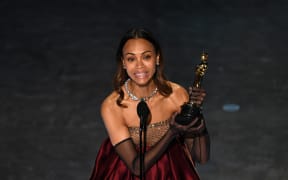 US actress Zoe Saldana accepts the award for Best Actress in a Supporting Role for "Emilia Perez" onstage during the 97th Annual Academy Awards at the Dolby Theatre in Hollywood, California on March 2, 2025. (Photo by Patrick T. Fallon / AFP) / ALTERNATE CROP