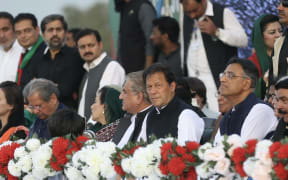 Prime Minister of Pakistan Imran Khan (second from right) at a rally in Islamabad in support of his ruling PTI party.
