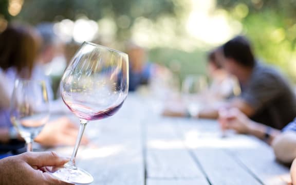 man holding wine glass