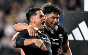 Quinn Tupaea celebrates his try with Wallace Sititi.