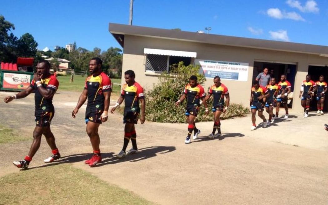 PNG Hunters players walk out against the Wynnum Manly Seagulls.