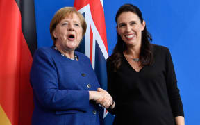 German Chancellor Angela Merkel shakes hands with Prime Minister Jacinda Ardern following a joint press conference on 17 April in Berlin.