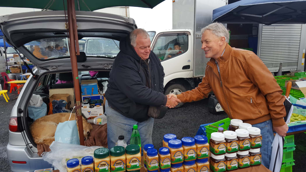 Phil Goff greets locals at the Avondale market.