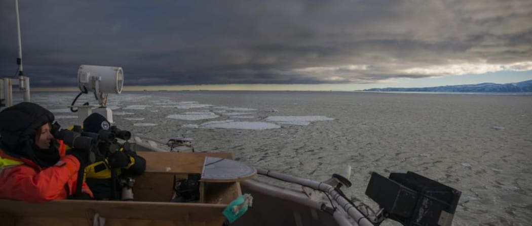 On whale watch: As the Tangaroa approaches Terra Nova Bay, Kim Goetz (Cetacean biologist, NIWA) and Kym Collins (AAD) look out for whales.