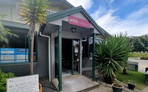 The Puketapu pub with a sign for donations out front.