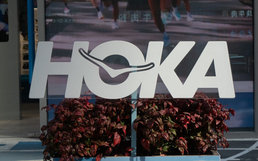 The HOKA name and logo outside a store in China.