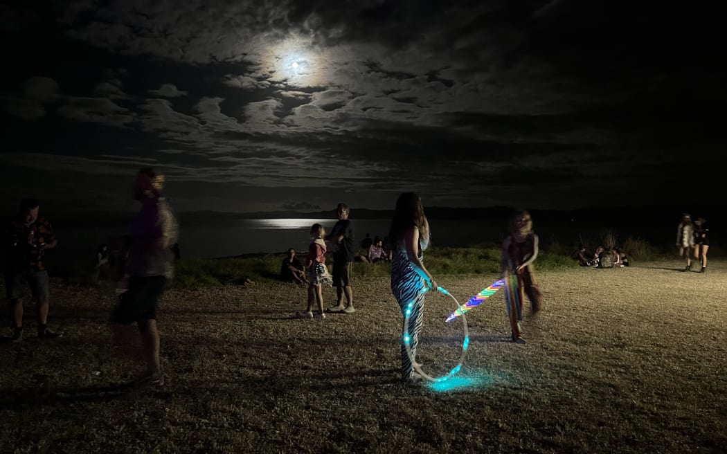 Hula hoopers on the beach at Splore