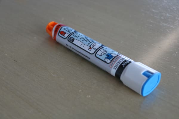 An EpiPen on a table.
