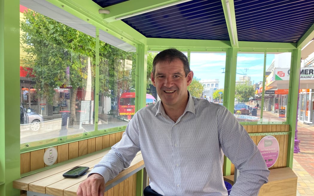 Timaru Mayor Nigel Bowen takes a seat in the Stafford St MyWay parklet.