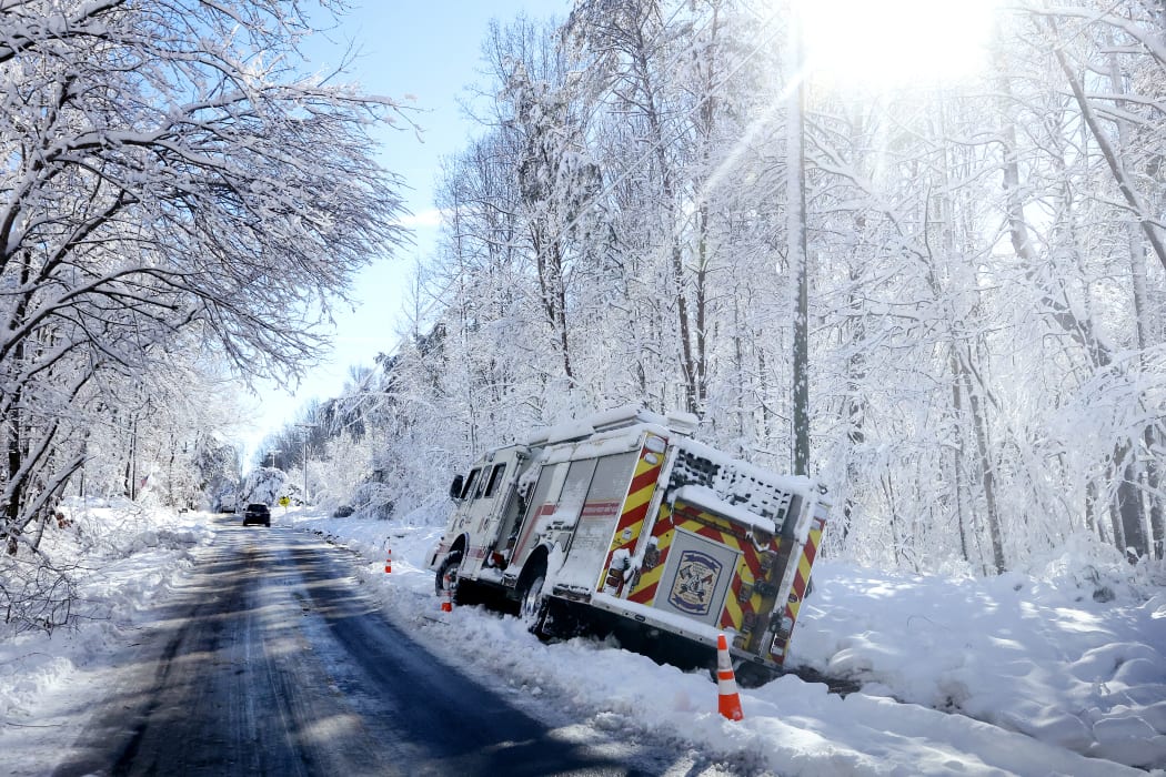 A fire engine rests on the side of the road after sliding off in icy conditions January 04, 2022 in Stafford County, Virginia.