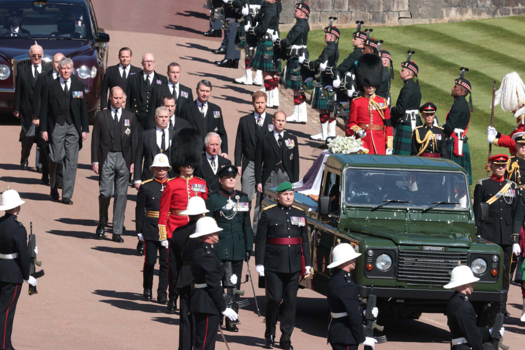 Members of the Royal family walk behind a land rover carrying the coffin of Britain's Prince Philip, Duke of Edinburgh during the ceremonial funeral procession to St George's Chapel in Windsor Castle in Windsor, west of London, on April 17, 2021.