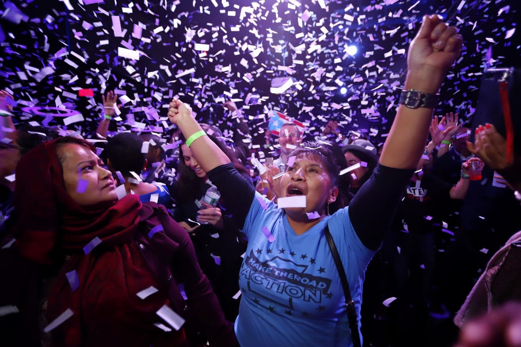 Mazeda Uddin and Marta Cualotuna celebratre the victory of Alexandria Ocasio-Cortez.