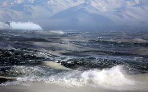 Diatom blooms occurring in newly forming frazil sea ice in the stormy waters of the Ross Sea.