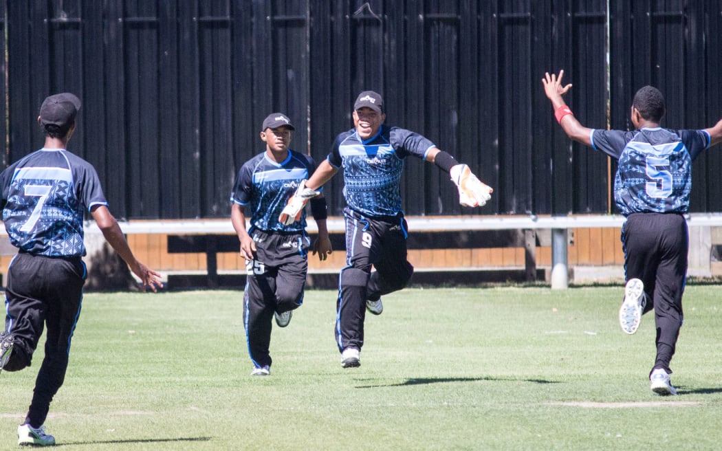 Fiji players celebrate a wicket against Vanuatu at the East Asia Pacific Under 19 Trophy.