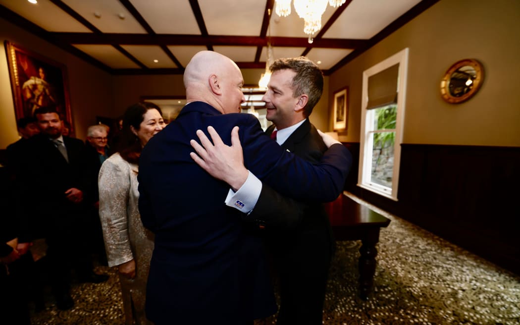 David Seymour & Christopher Luxon while Dame Cindy Kiro looks on.