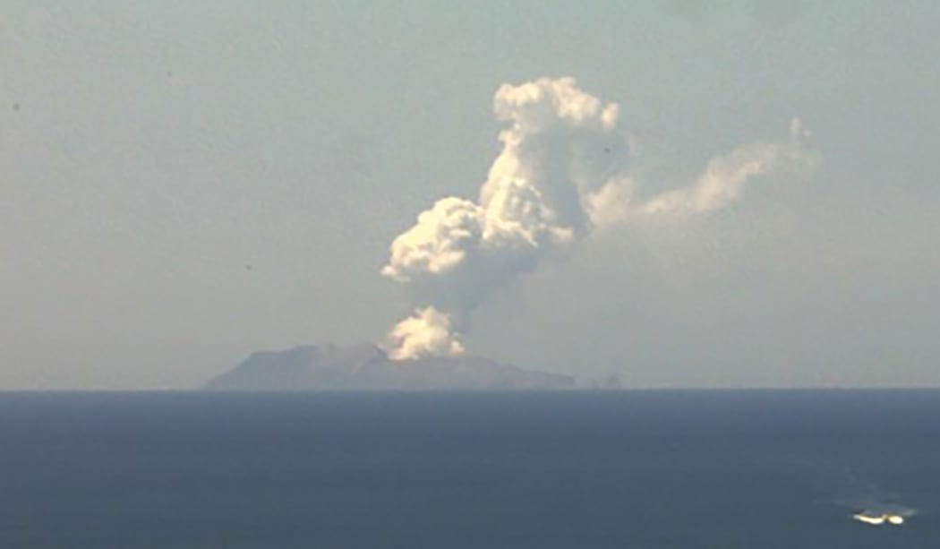 This handout image from a webcam belonging to the Institute of Geological and Nuclear Sciences shows the volcano on New Zealand's White Island spewing steam and ash on December 9, 2019. -